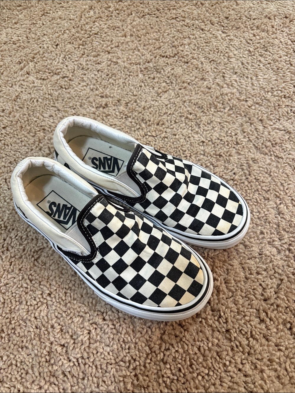 Vans Slip-On Checkerboard Sneakers in Black and White
